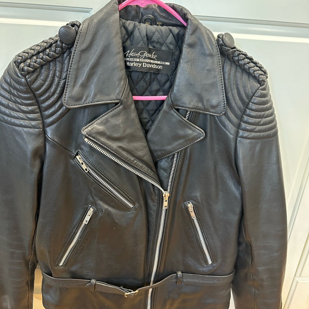 Harley Davidson leather jacket with zippers and belt.